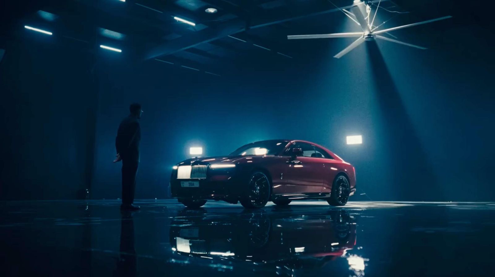 Rolls-Royce Black Badge Spectre under a spotlight